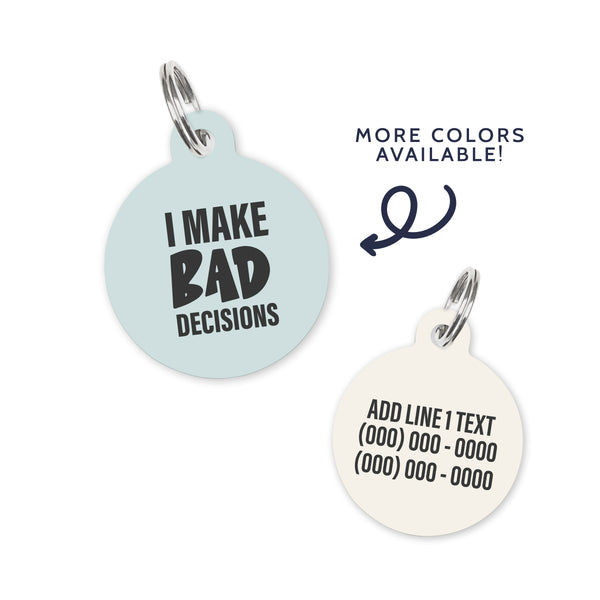 A light blue colored dog ID Tag with dark grey text stating a funny quote: I make bad decisions