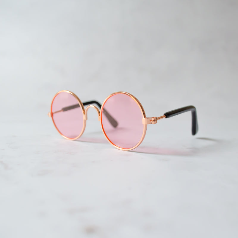 Dog sunglasses with pink lenses and rose gold frame
