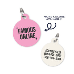 A light pink colored dog ID Tag with dark grey text and sparkles stating a funny quote: famous online