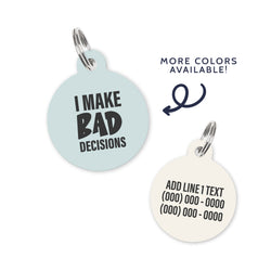 A light blue colored dog ID Tag with dark grey text stating a funny quote: I make bad decisions