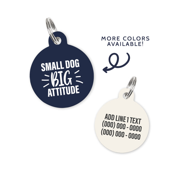 A dark navy blue colored dog ID Tag with white text stating a funny quote: small dog big attitude