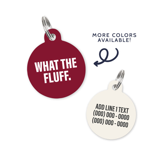 A dark red/burgundy colored dog ID Tag with white text stating a funny quote: what the fluff.